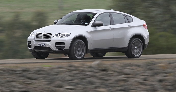 BMW-X6-M50d-side-driving.jpg